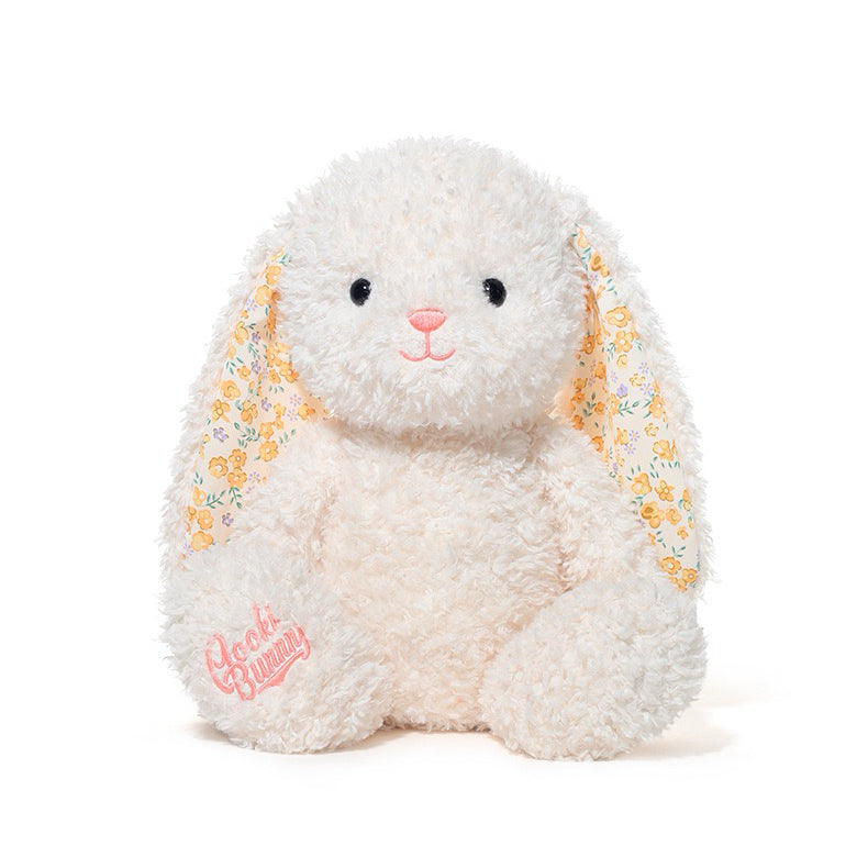 Plush bunny toy with floral ears on a white background