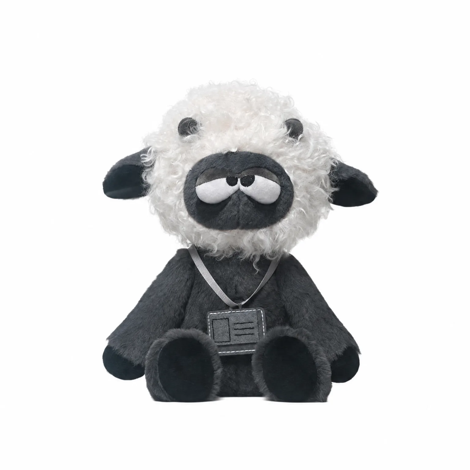 Plush toy sheep with a gray outfit on a white background