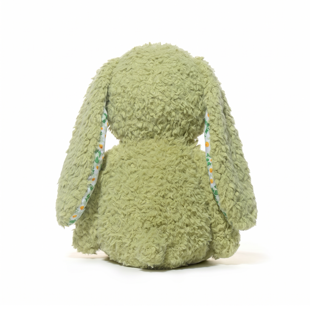 Green plush bunny in a white background