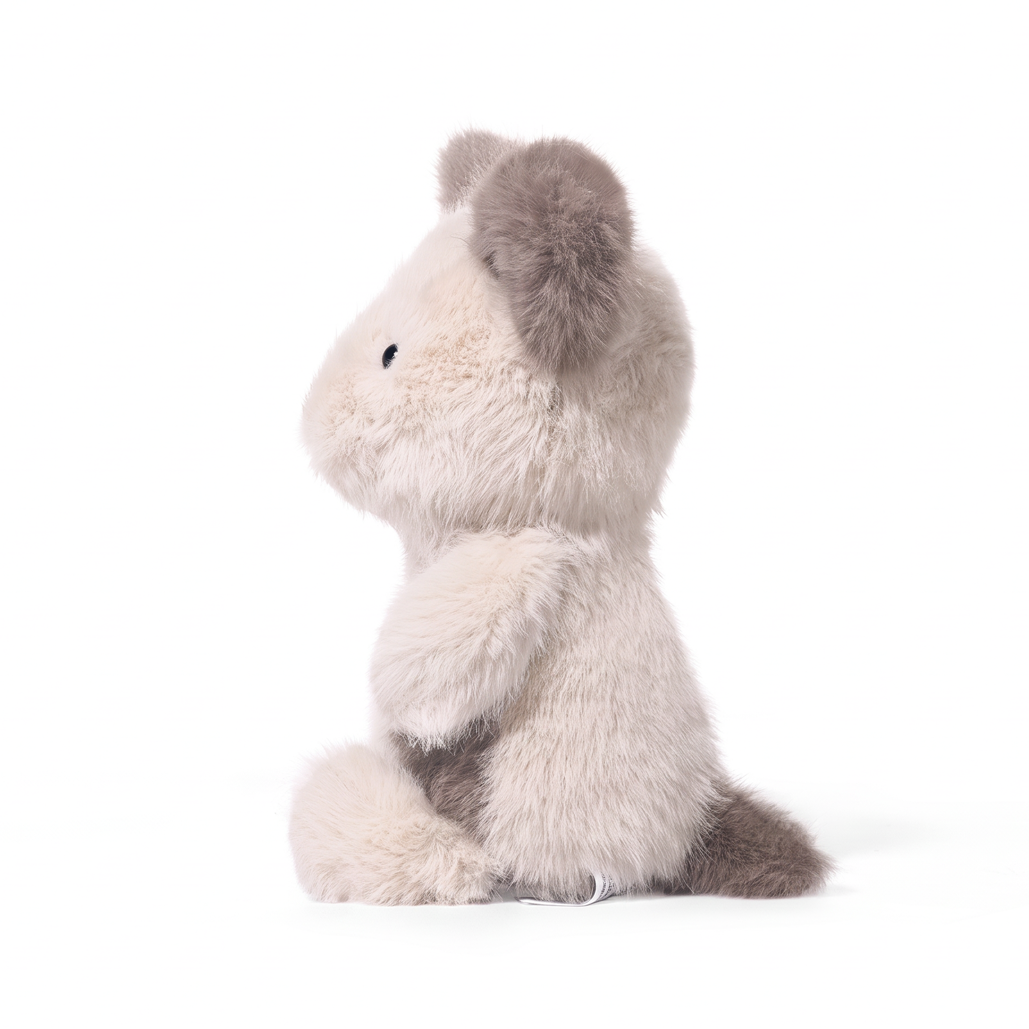 Remi Dog plush stuffed animal toy, side view