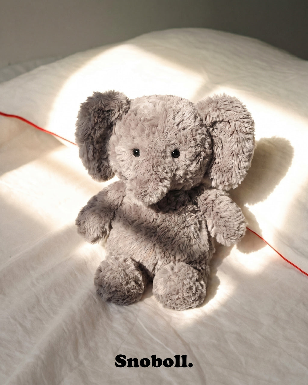 Snoboll plush toy, lifestyle photo